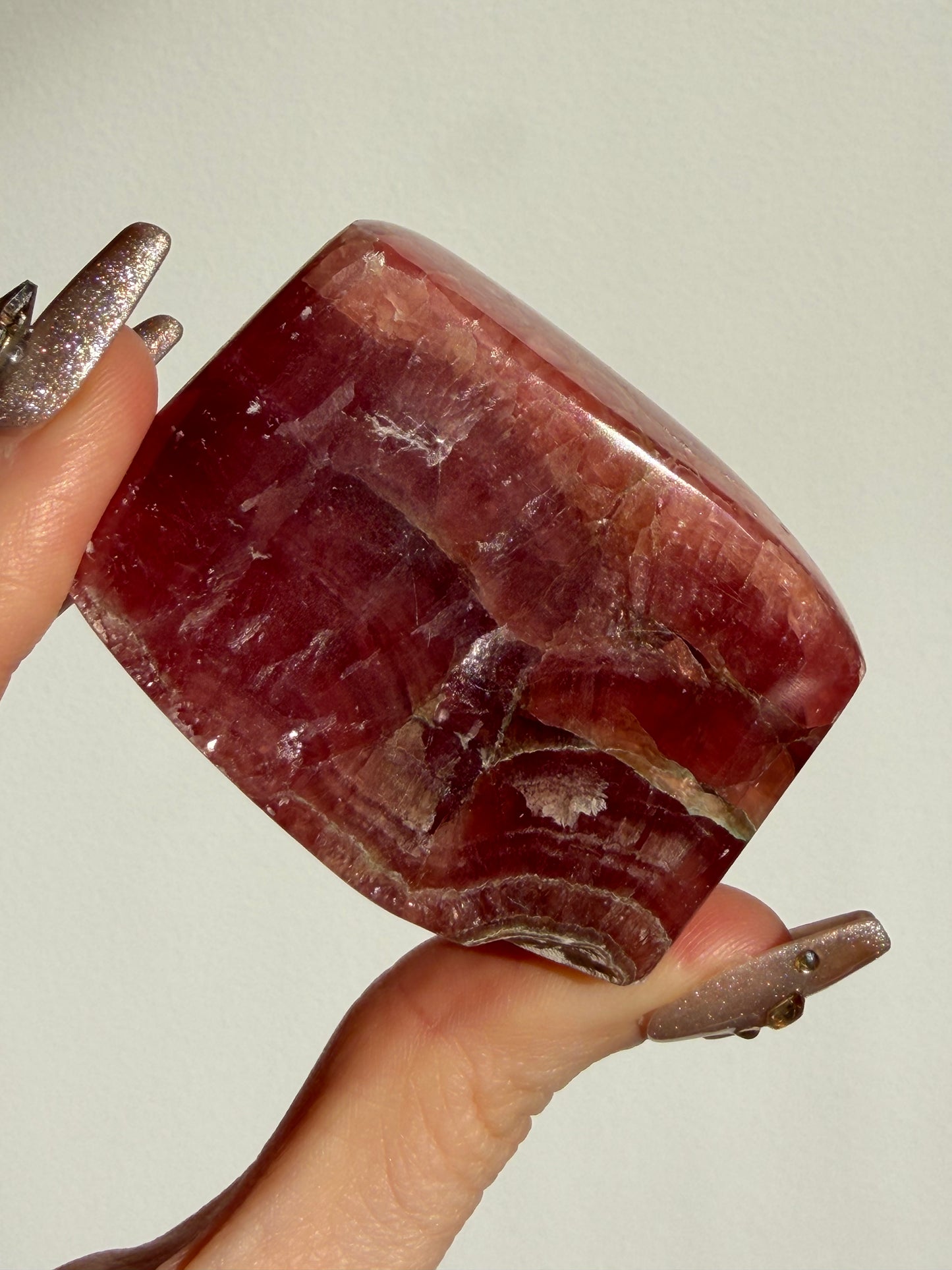 “Luminance” Gemmy Gel Rhodochrosite Freeform with Copper Inclusions