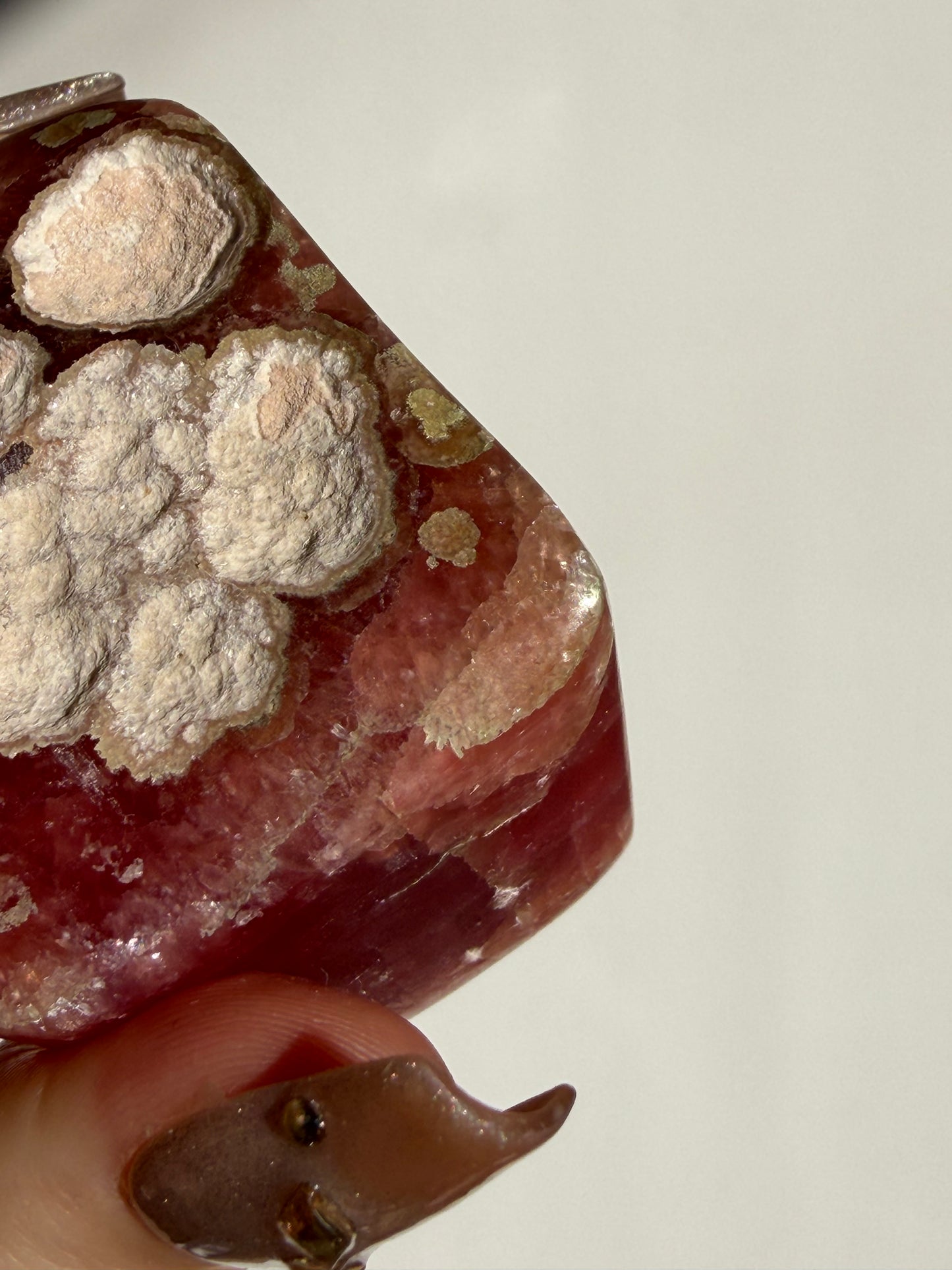 “Luminance” Gemmy Gel Rhodochrosite Freeform with Copper Inclusions
