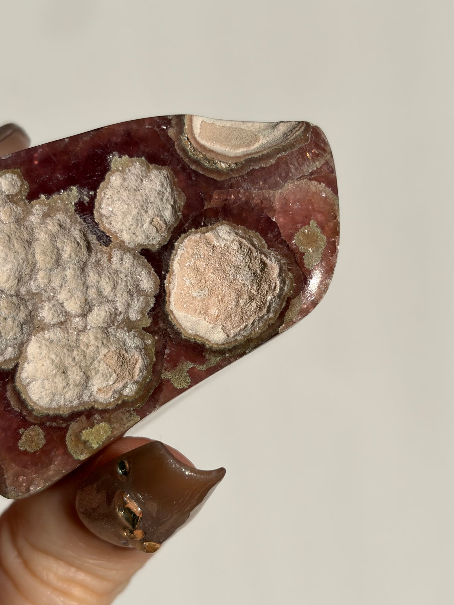 “Luminance” Gemmy Gel Rhodochrosite Freeform with Copper Inclusions