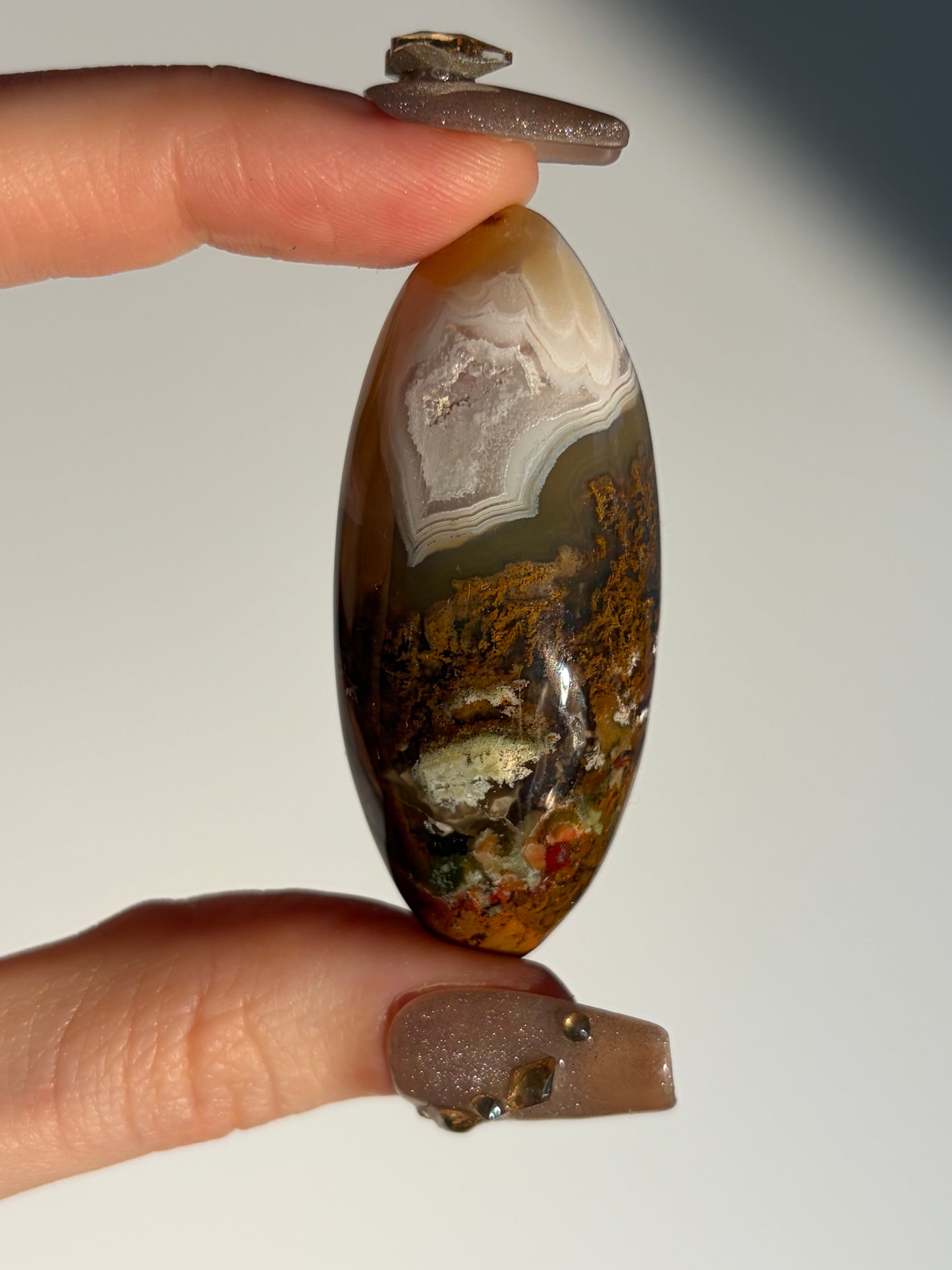 Nebula Agate with Amethyst and Red Moss Inclusions Shiva J (Parallax Effect)