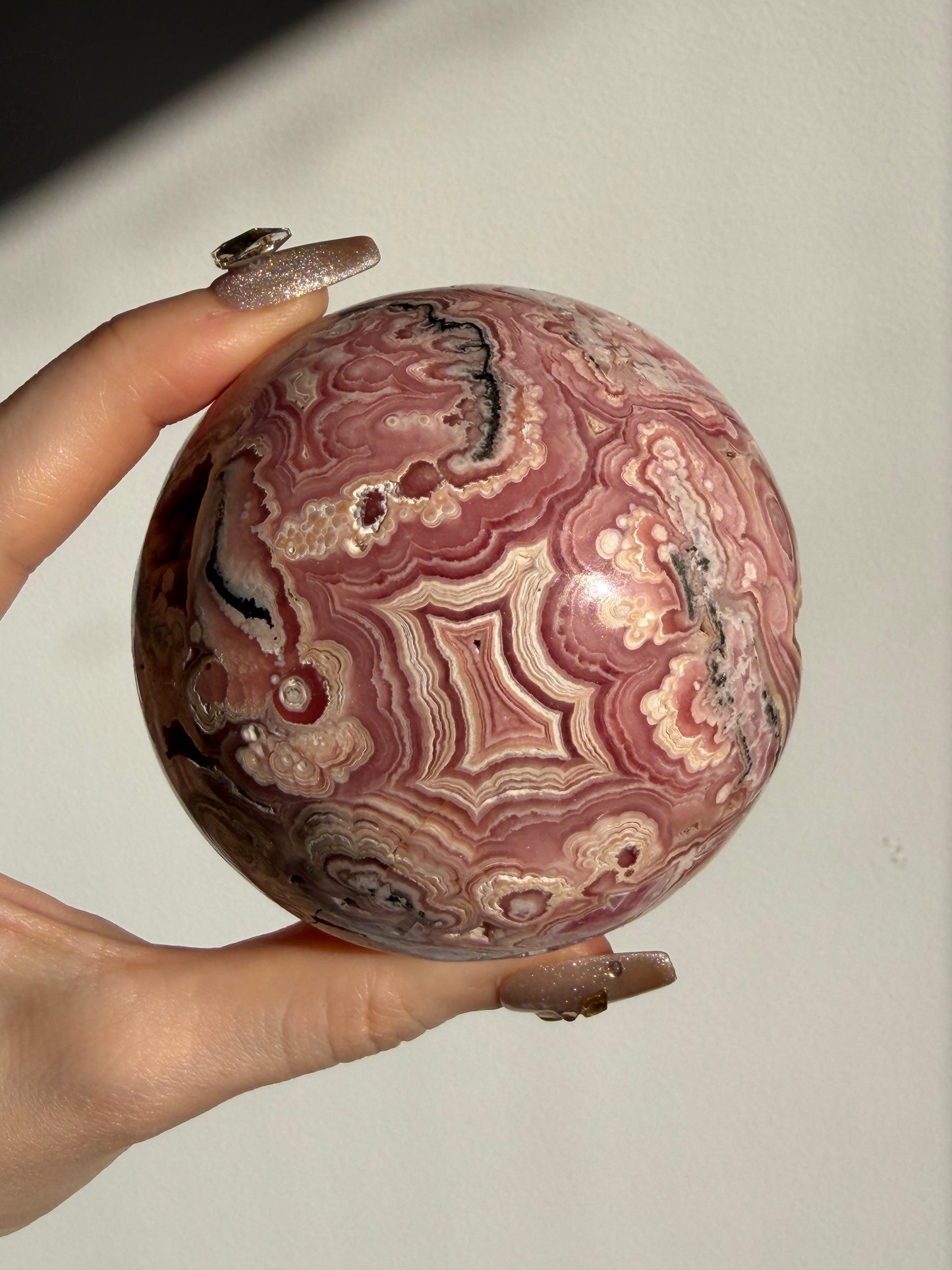 “Rosen Blooms” Floral Banded Rhodochrosite Sphere A