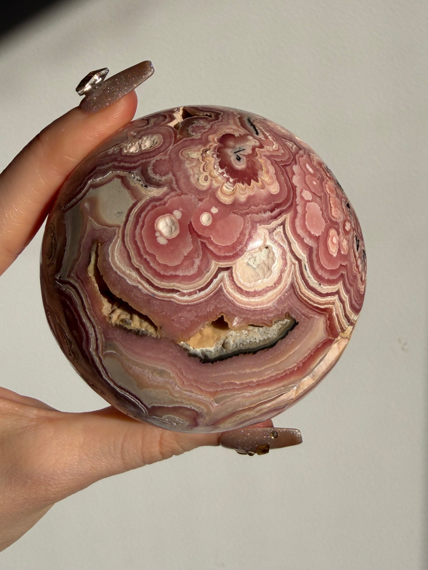 “Rosen Blooms” Floral Banded Rhodochrosite Sphere A