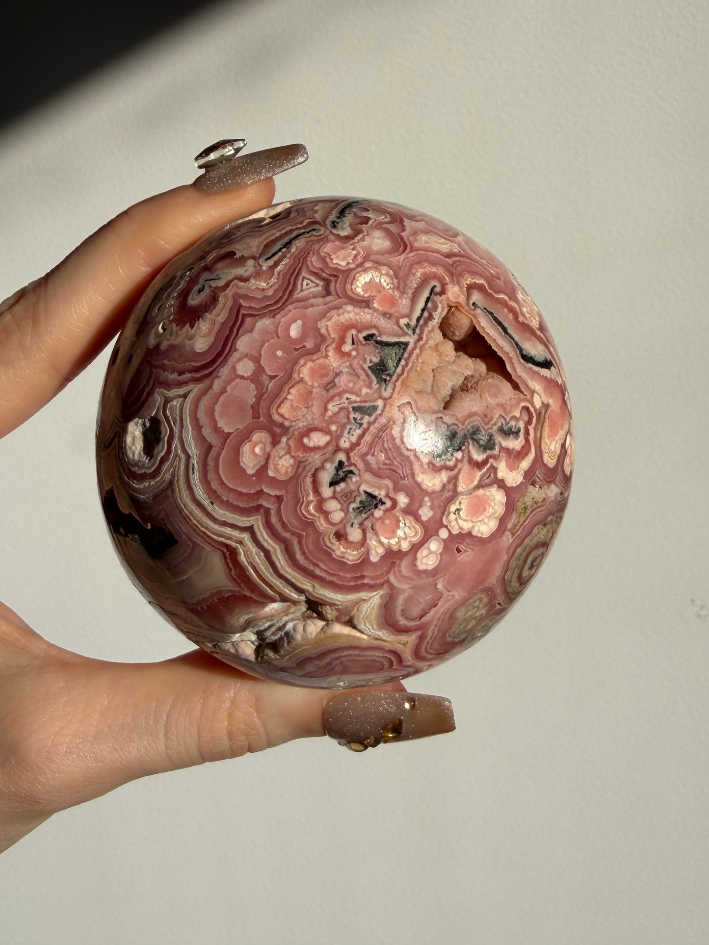 “Rosen Blooms” Floral Banded Rhodochrosite Sphere A
