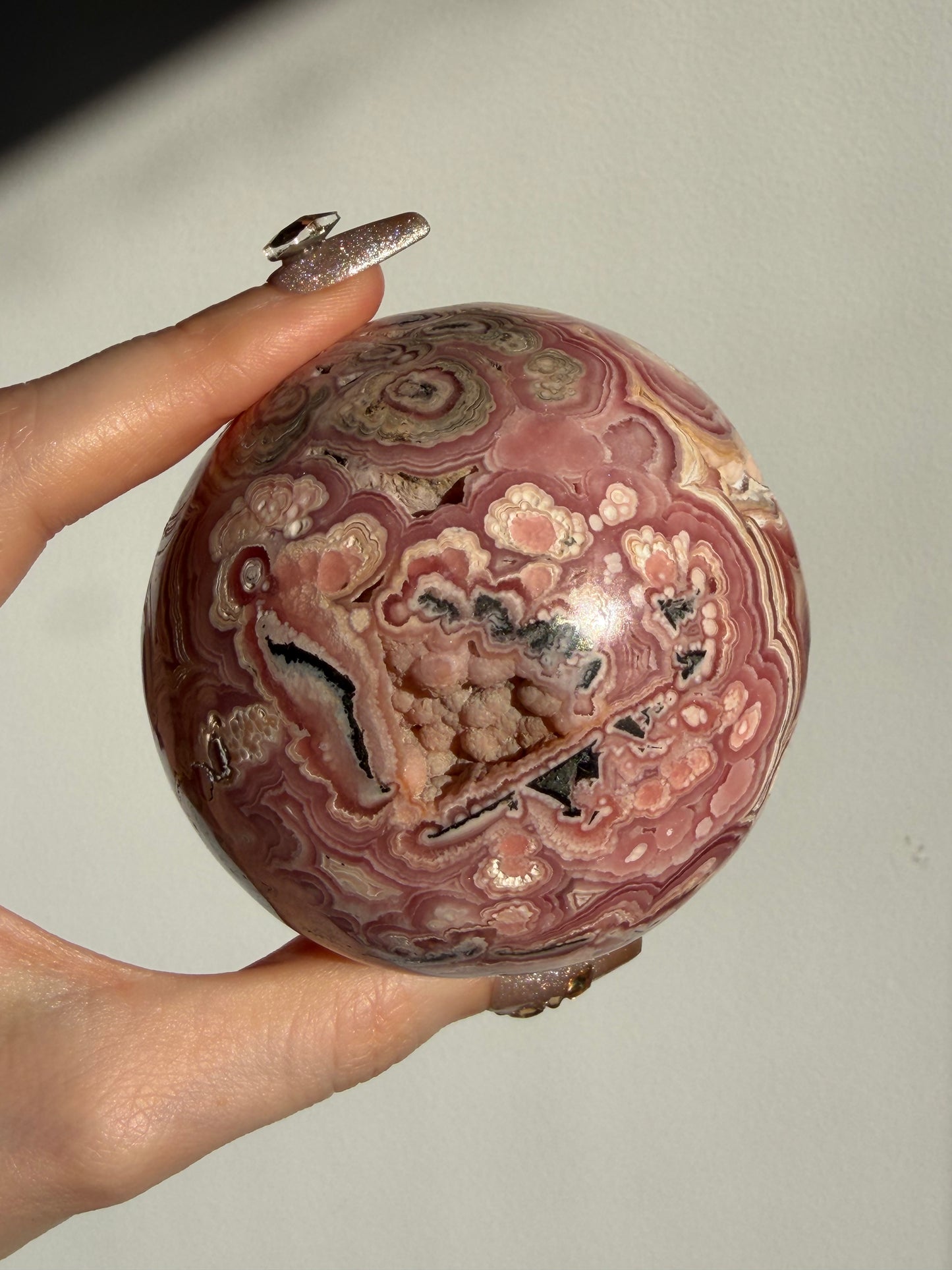 “Rosen Blooms” Floral Banded Rhodochrosite Sphere A