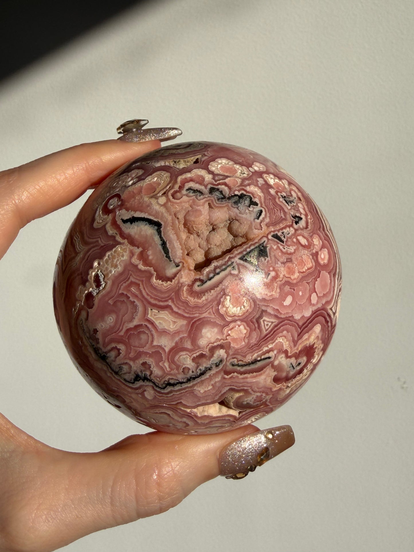 “Rosen Blooms” Floral Banded Rhodochrosite Sphere A