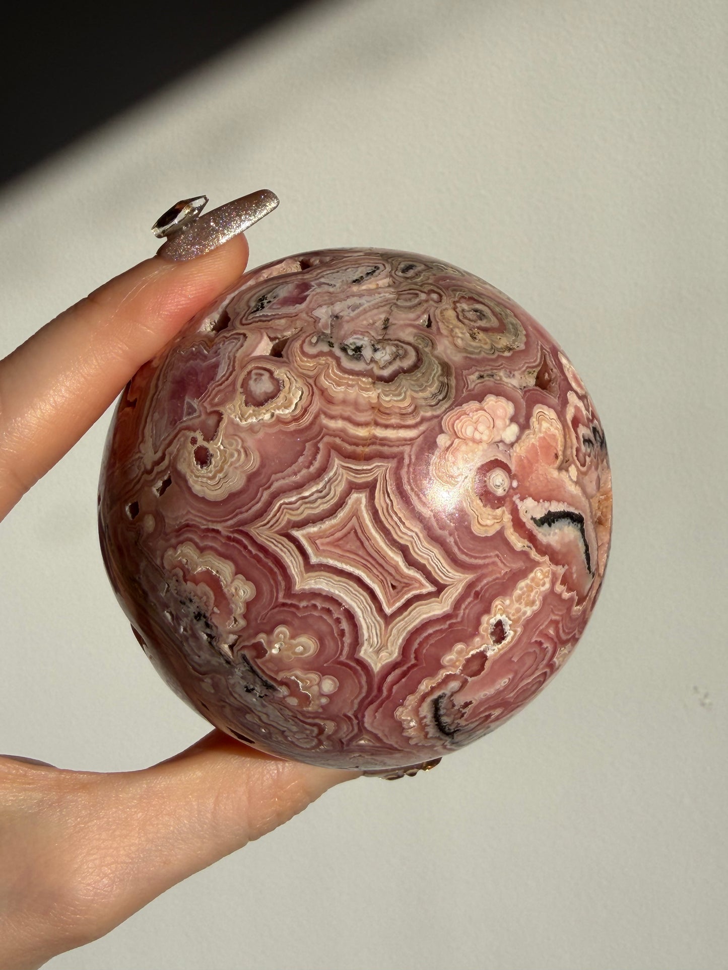 “Rosen Blooms” Floral Banded Rhodochrosite Sphere A