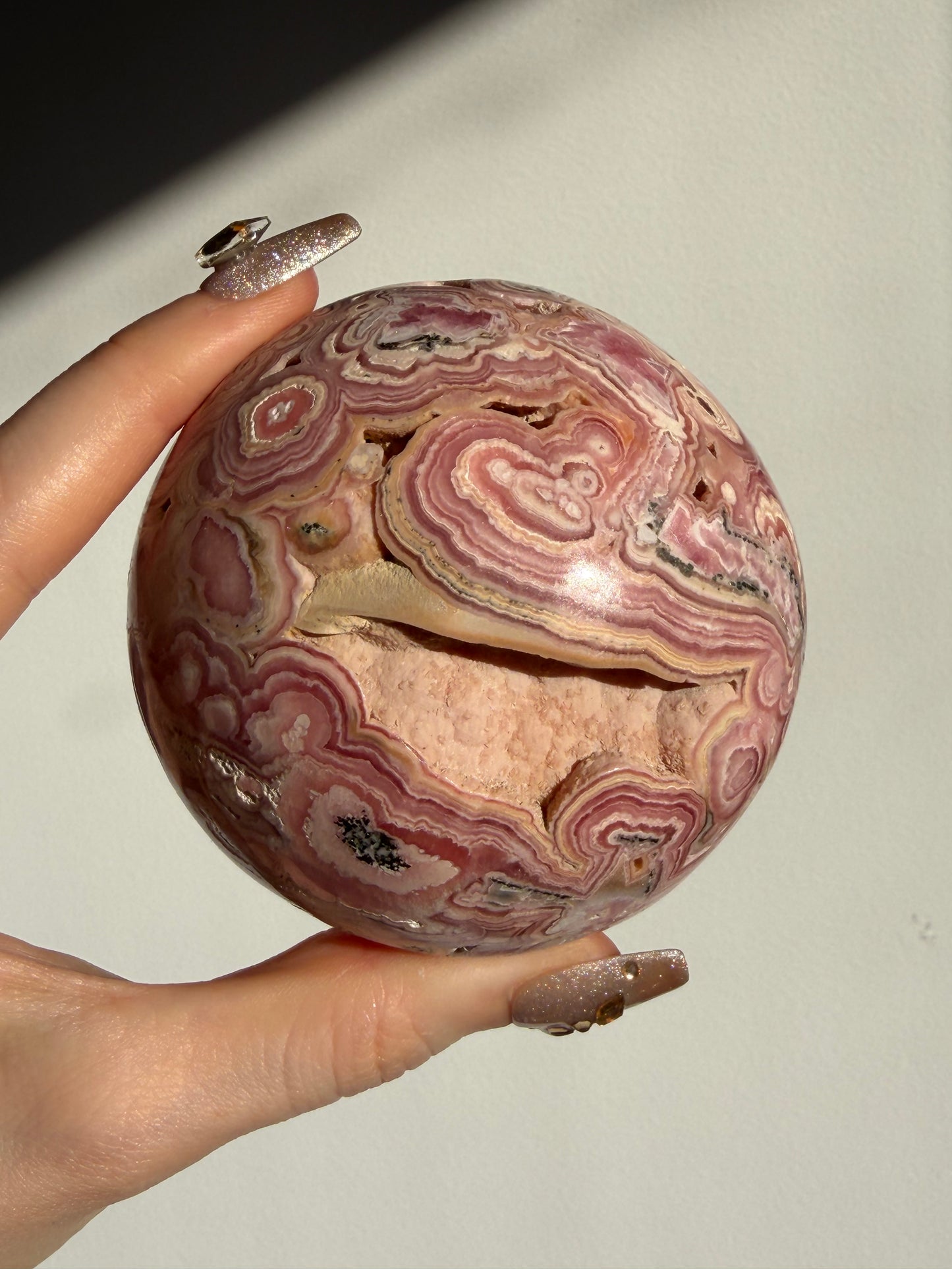 “Rosen Blooms” Floral Banded Rhodochrosite Sphere A