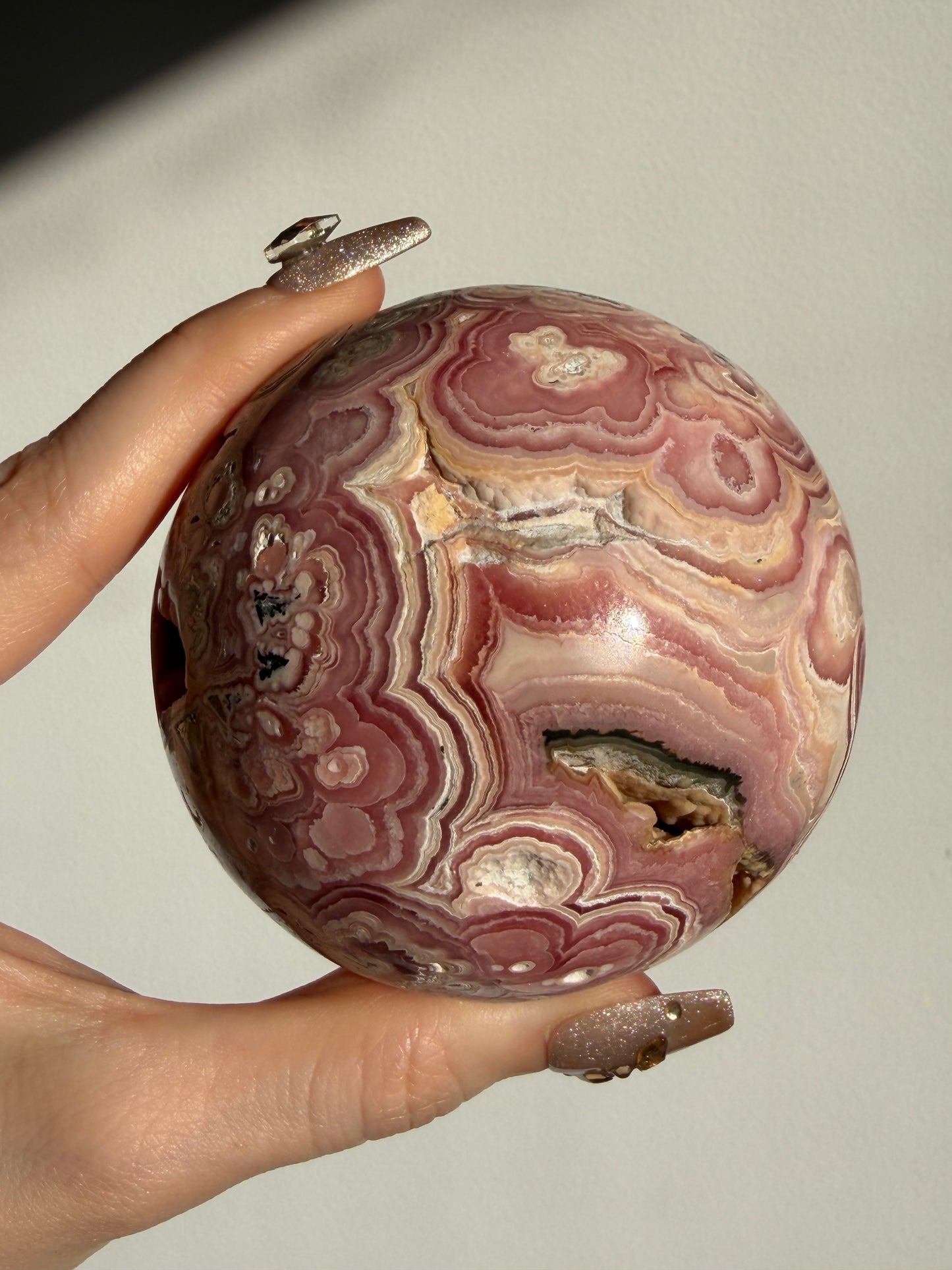 “Rosen Blooms” Floral Banded Rhodochrosite Sphere A