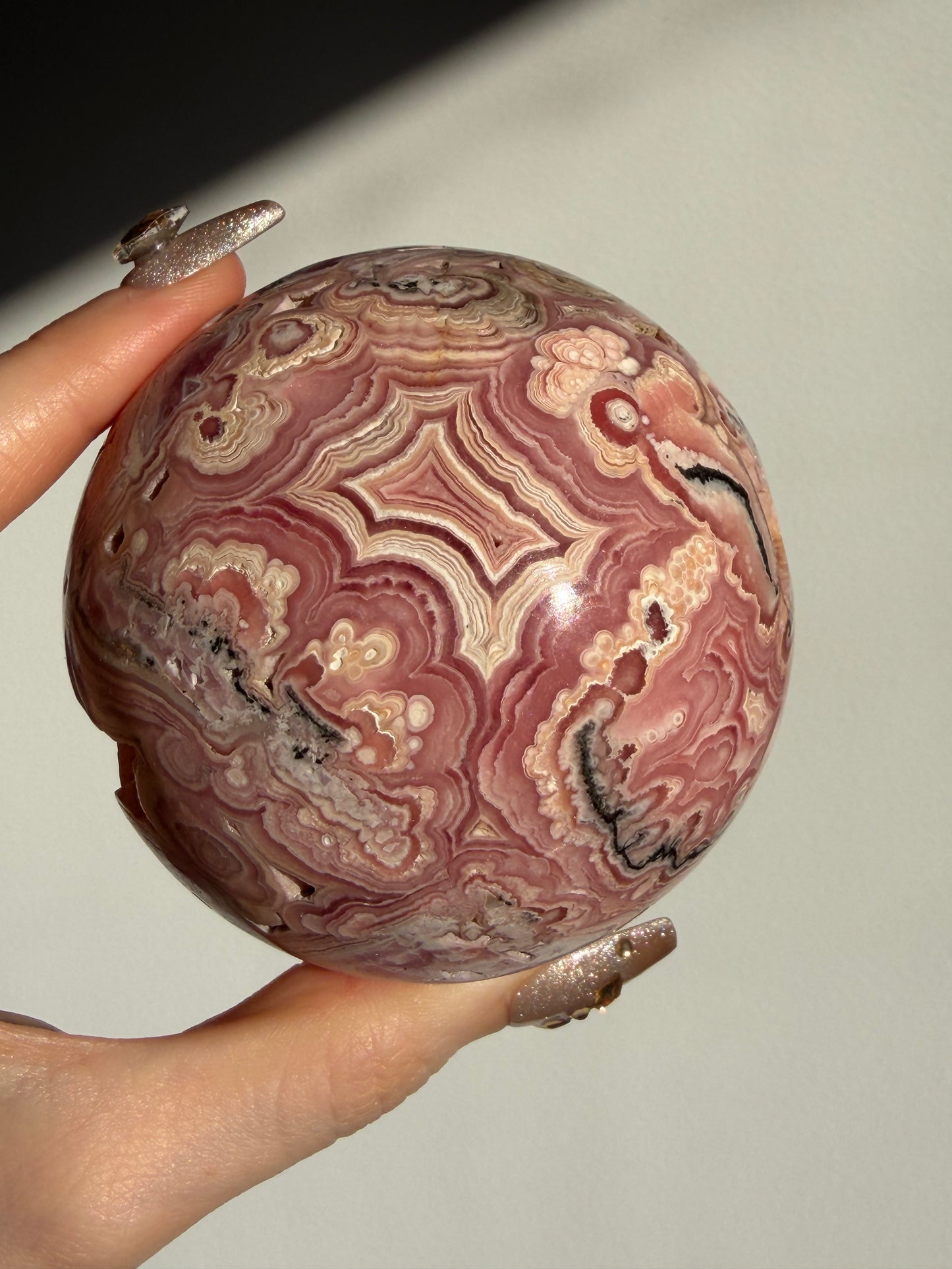 “Rosen Blooms” Floral Banded Rhodochrosite Sphere A
