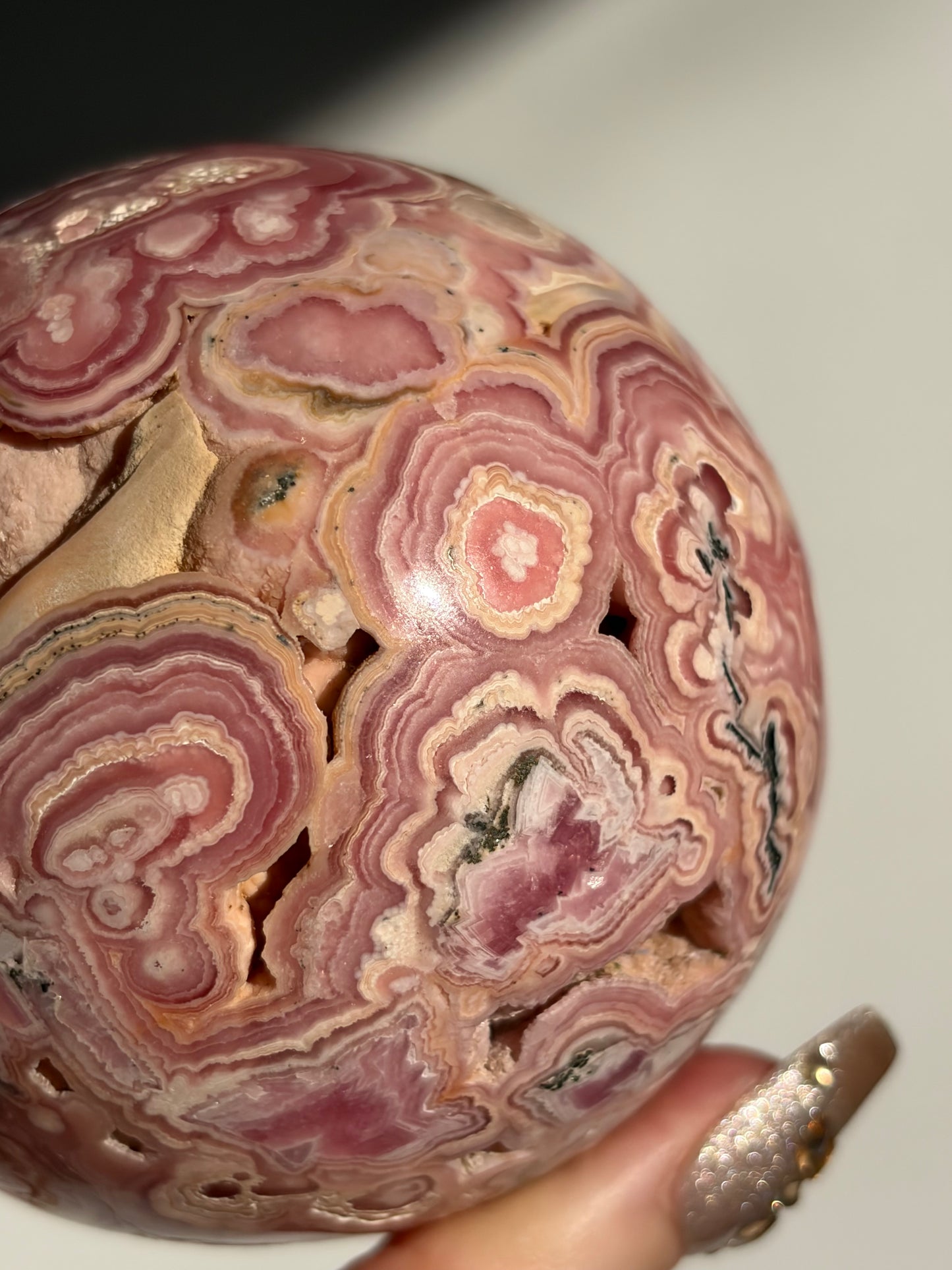 “Rosen Blooms” Floral Banded Rhodochrosite Sphere A