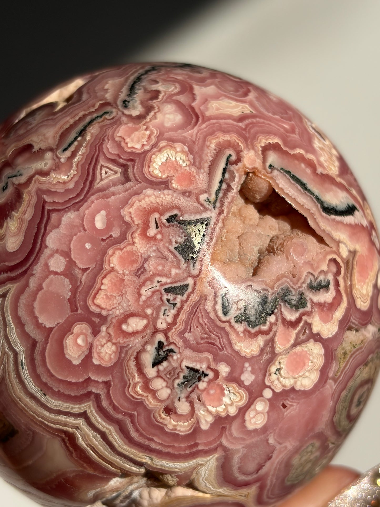 “Rosen Blooms” Floral Banded Rhodochrosite Sphere A